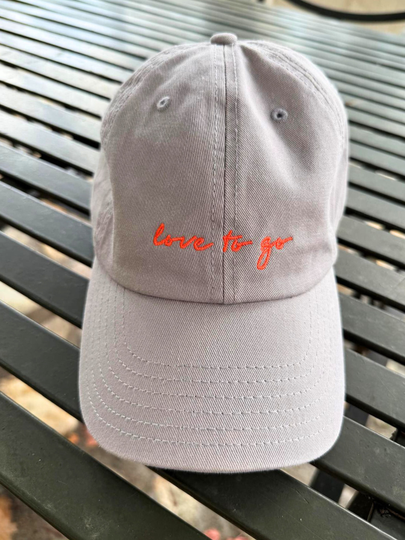 love to go cap in gray with neon orange