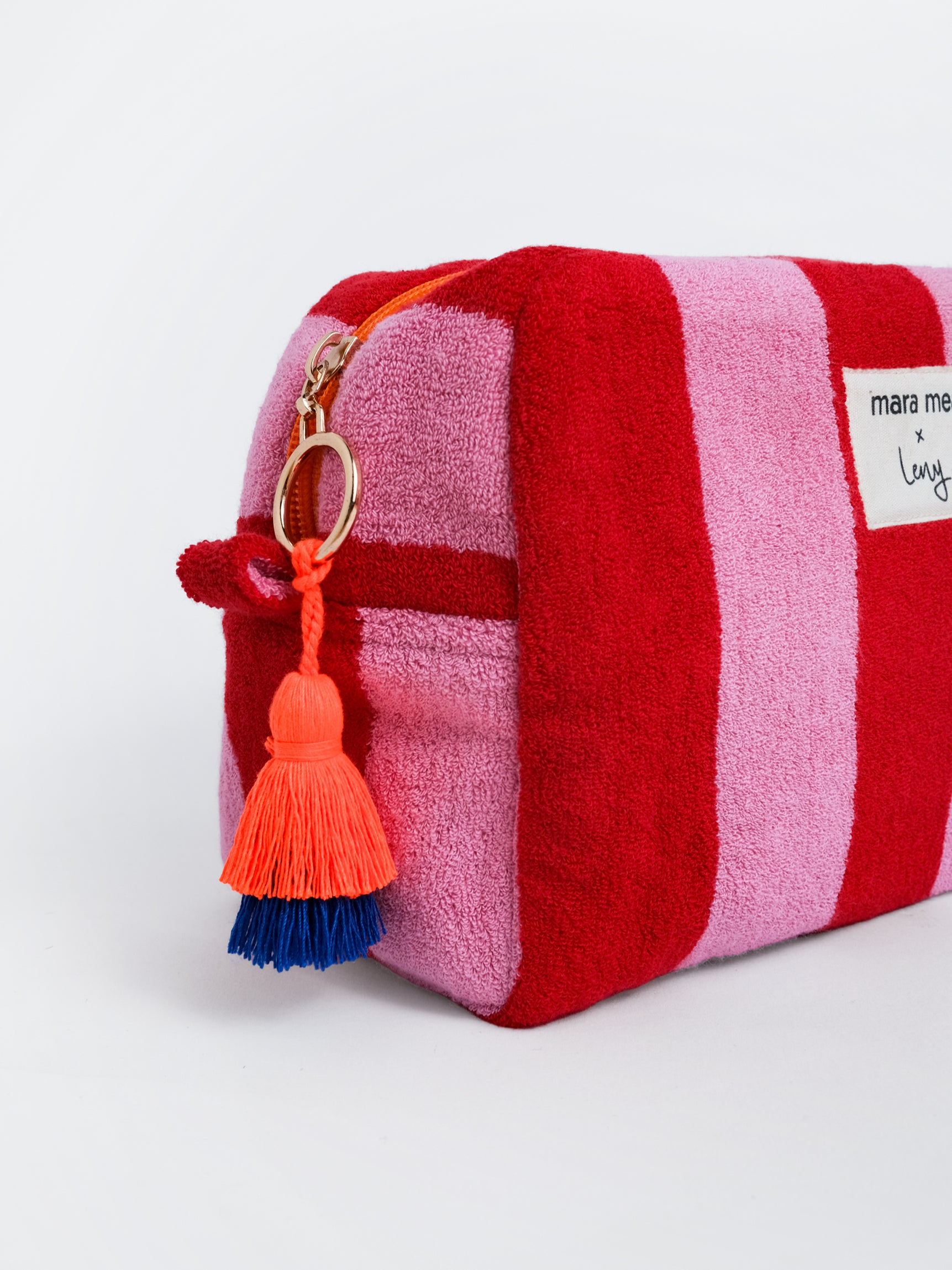 Kosmetiktasche aus Frottee in Rot und Rosa mit orange-blauer Quaste und goldenem Reißverschlussring